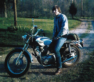 Robert J. Kates on his Triumph motorcycle 